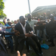 Senator Willot Joseph holds a gun as he arrives to parliament in Port-au-Prince on Sept. 23. Joseph pulled a pistol when opposition party supporters rushed at him and members of his entourage.